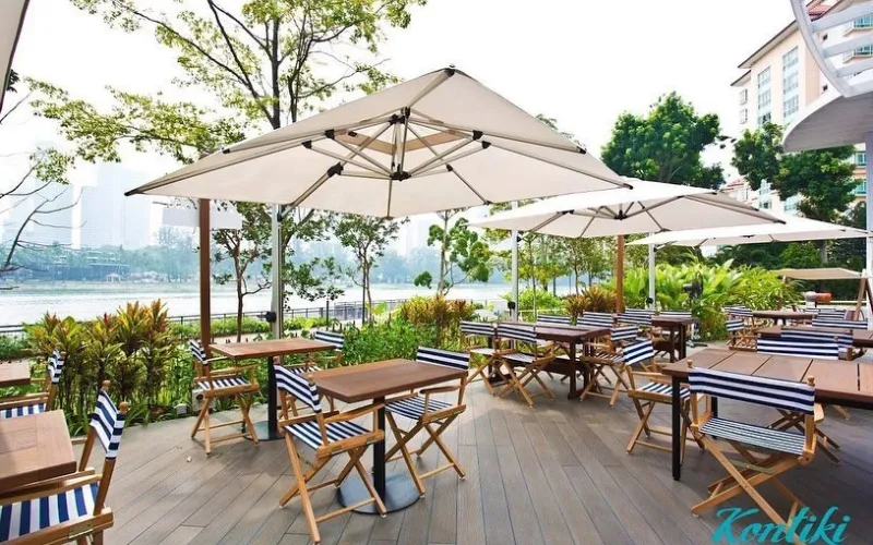 Kontiki outdoor dining area with marine-themed furniture